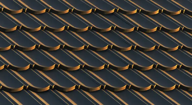 Close view of asphalt shingles on a pitched roof