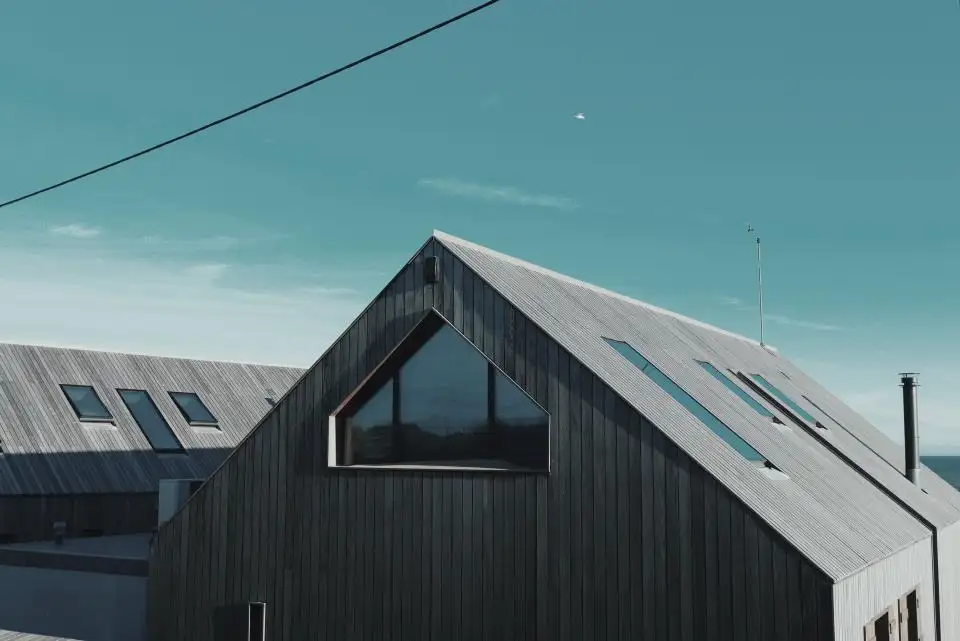 Pitched asphalt shingle roof on a house