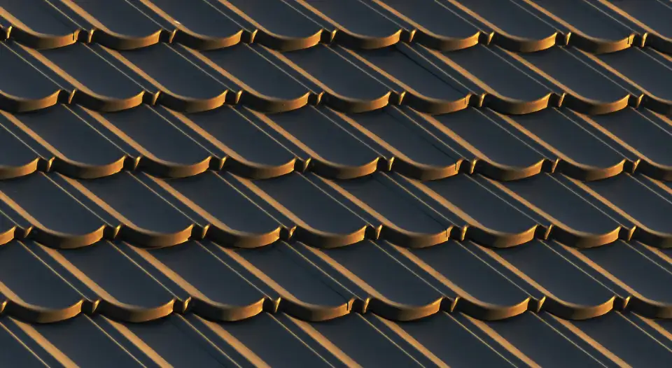 Close view of asphalt shingles on a pitched roof