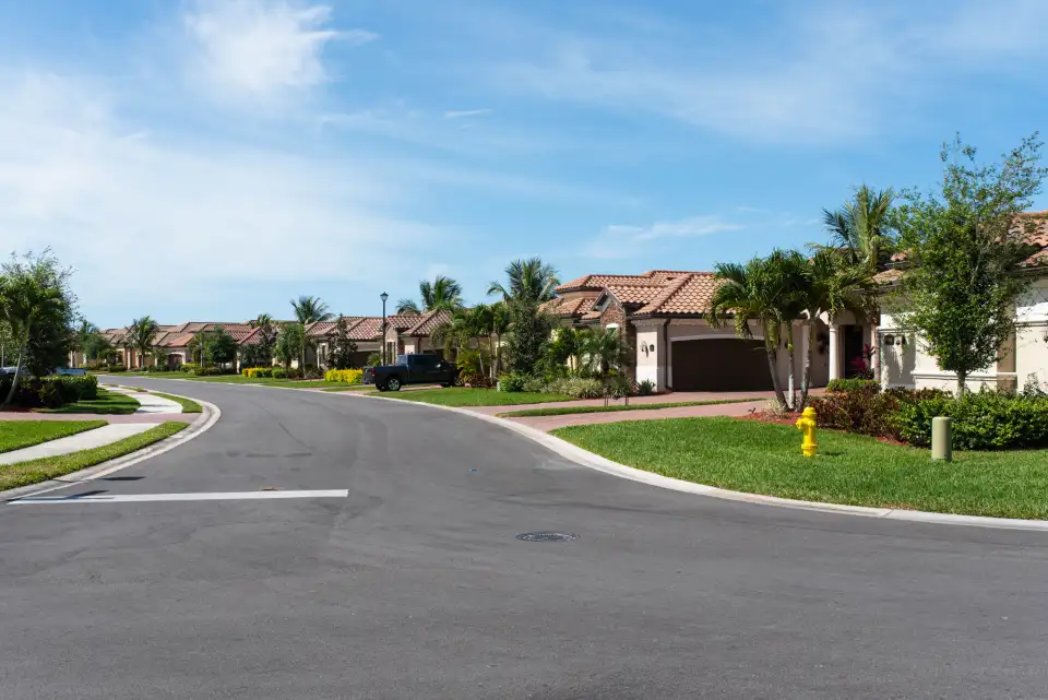 A residential street of houses with pitched roofs